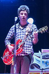 Noel Gallagher playing live at the Bell Centre, Montreal in 2008 Noel Gallagher playing Champagne Supernova.jpg