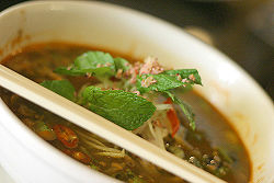 A bowl of Penang laksa, a variant of assam laksa.