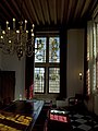 Inside, the Nieuwe Kerk is seen through the window