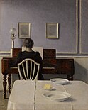 Interieur met vrouw achter de piano, 1901
