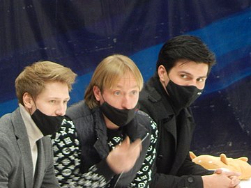 Coaches Dmitri Mikhailov (left) and Evgeni Plushenko (center)