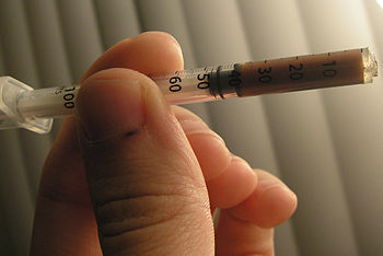 English: Modified IM/IV syringe used for "...