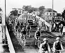Japanese troops on bicycles advance into Saigon JapanTakeSaigon bridge.jpg