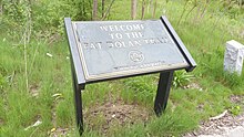 East end trail marker for the Pat Dolan Trail located at the end of the bridge from the Mauro Playground Pat Dolan Trail Marker East End.jpg