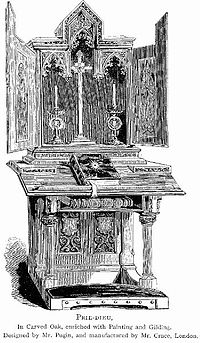 A fairly large, elaborately carved prie-dieu with a built-in altar that can be closed Prie-dieu in Carved Oak, Designed by Mr. Pugin.jpg
