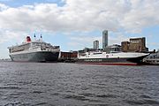 Queen Mary 2 with Isle of Man Steam Packet Company ferry HSC Manannan at Pier Head