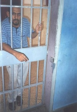 Sahrawi human rights defender Ali Salem Tamek during his imprisonment in Ait Melloul prison, near Agadir, Morocco. 29 August 2005 Tamekinprison.jpg