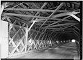 (image 8 of 9) 1984 Looking up, inside, upper lateral braces, sway braces, roof rafters, collar beams, purlins, and roof sheathing