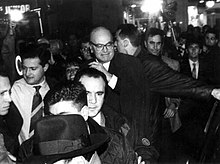 Bettino Craxi, viewed by many as the symbol of Tangentopoli, Leader of the Socialist Party and Prime Minister from 1983 to 1987, is greeted by a salvo of coins as a sign of loathing by protesters. Echadas de Monedas.jpg