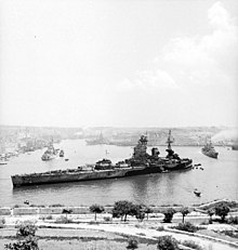 HMS Rodney in the harbour during the Allied invasion of Sicily. HMS Rodney 1943 Malta.jpg