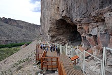 Photograph of tourists visiting the cave