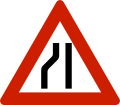 Road narrows On left side.