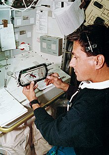 Astronaut Donald Thomas examines a newt on the Space Shuttle Columbia during a 1994 mission Space newt.jpg