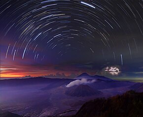 A timelapse composite panorama of different natural phenomena and environments around Mount Bromo, Indonesia. Startrails above Gunung Bromo - Indonesia.jpg