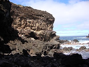 Volcanic rock cliff at Ana Kai Tangata, Easter...