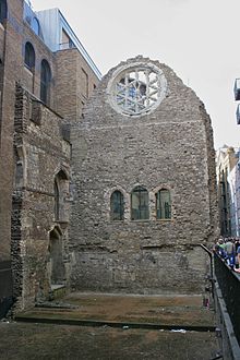 Remains of the great hall of Winchester Palace, yards from London Bridge in Southwark showing the Rose Window and underneath the traditional arrangement of three doors from the screens passage to the buttery, pantry and kitchen. Until 1877 all of Surrey (including Southwark) was part of the diocese. Winchester Palace.jpg