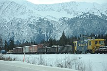 Freight train featuring open and closed cars with ARR 1093, near Alyeska area, Seward Highway, making a winter run, 2013 Alaska railroad, open and closed cars, near Alyeska area, Seward Highway, making a winter run, 1093, south east of Anchorage, Alaska, USA (11878202086).jpg