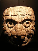 A Chavin stone sculpture in the shape of a head