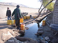 Fetching water from a spring.