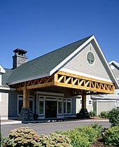 A large timber Howe truss in a commercial building Large Timber Howe Truss.jpg