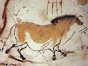 Painting of a dun horse on the wall of Lascaux Cave in France.