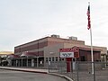 The modern facility next to the historic schoolhouse.