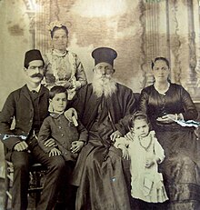 Married Eastern Orthodox priest from Jerusalem with his family (three generations), circa 1893 Orthodox priest family.jpg