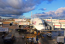 Aircraft ground handling with separate jetways for the main and upper decks, and ground support equipment on a Qatar Airways A380 Qatar Airways Airbus A380-800 at Heathrow Airport Terminal 4 before Flying to Doha, 6 Jan 2015.jpg