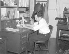 Engineer using a slide rule, with mechanical calculator in background, mid 20th century Slideruleinuse.wpafb.chap2-2.jpg