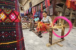 Local craftswomen weaving Ulos in Huta Raja village, Ulos is Bataknese traditional Tenun which is popular exported as garment from North Sumatra Tenun Ulos.jpg