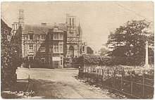 Black and white postcard of East Knoyle, showing the war memorial