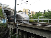 Airport Express Train at Etterstad out of the Romerike Tunnel.jpg