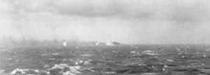 Battleship Bismarck burning and sinking 1941.jpg