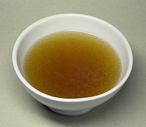 Consommé, a concentrated broth from beef, minc...