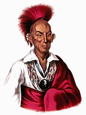 Native American chief with red headdress and red robe