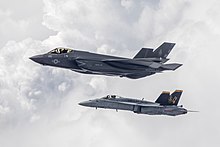 A F-35C and a F/A-18A of VMFA-314 in flight, in June 2019. F-35C Lightning II and FA-18A Hornet of VMFA-314 in flight over California on 5 June 2019 (190605-N-SS390-0118).JPG