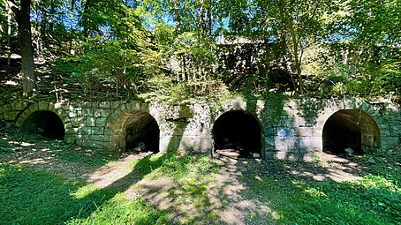 Remains of stone foundation with arches at the ironworks