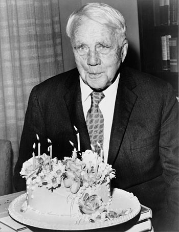 Robert Frost poses with his birthday cake on h...