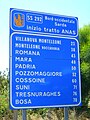 Cartello delle distanze chilometriche all'uscita sud di Alghero.
