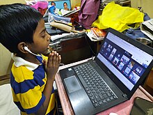 A student attending online class in Kerala, India, during the COVID-19 pandemic Student attending online class in Kerala.jpg