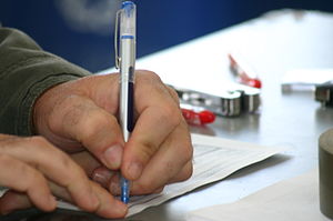 English: Blue ink on the inspection sheet indi...