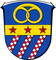 Wappen von Traisa, Ortsteil der Gemeinde Mühltal, in dem ebenfalls durch die blauähnlichen Schildfarbe und dreifacher geschachtetem Schrägrechtsbalken auf die früheren Ortsherren gedeutet wird.