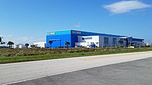 Blue Origin's manufacturing facility near KSC visitor complex BlueOrigin OLS mfg building, Florida (from southeast).jpg