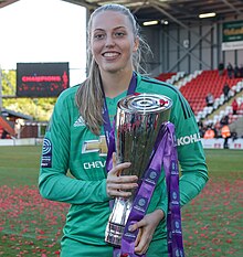 Ramsey for Manchester United holding the league trophy after winning the Championship, 11 May 2019. Man Utd Women 5 Lewes FC Women 0 11 05 2019-763 (46935127585).jpg