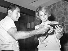 Serling models an airplane with actress Inger Stevens, who appeared in "The Hitch-Hiker" and "The Lateness of the Hour." Rod Serling Inger Stevens Serling model airplane collection 1960.JPG