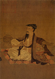 Dessin d'un homme barbu richement habillé assis sur un tapis.