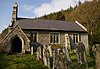 A single-storey church built in rubble stone with a bellcote and a porch at the Western end