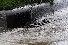 American-style curbside storm drain receiving urban runoff Storm Drain.JPG