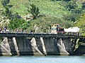 Locomotive no. 22 crossing Sigatoka bridge with a long train of empty wagons, near the end of the South Coast line.