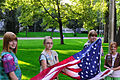 Girl Scouts raising the flag